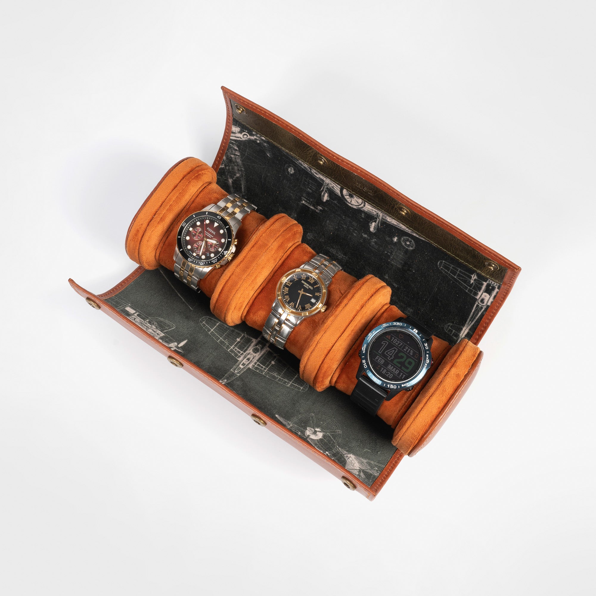 A leather travel watch roll displaying three elegant watches within a stylish case.