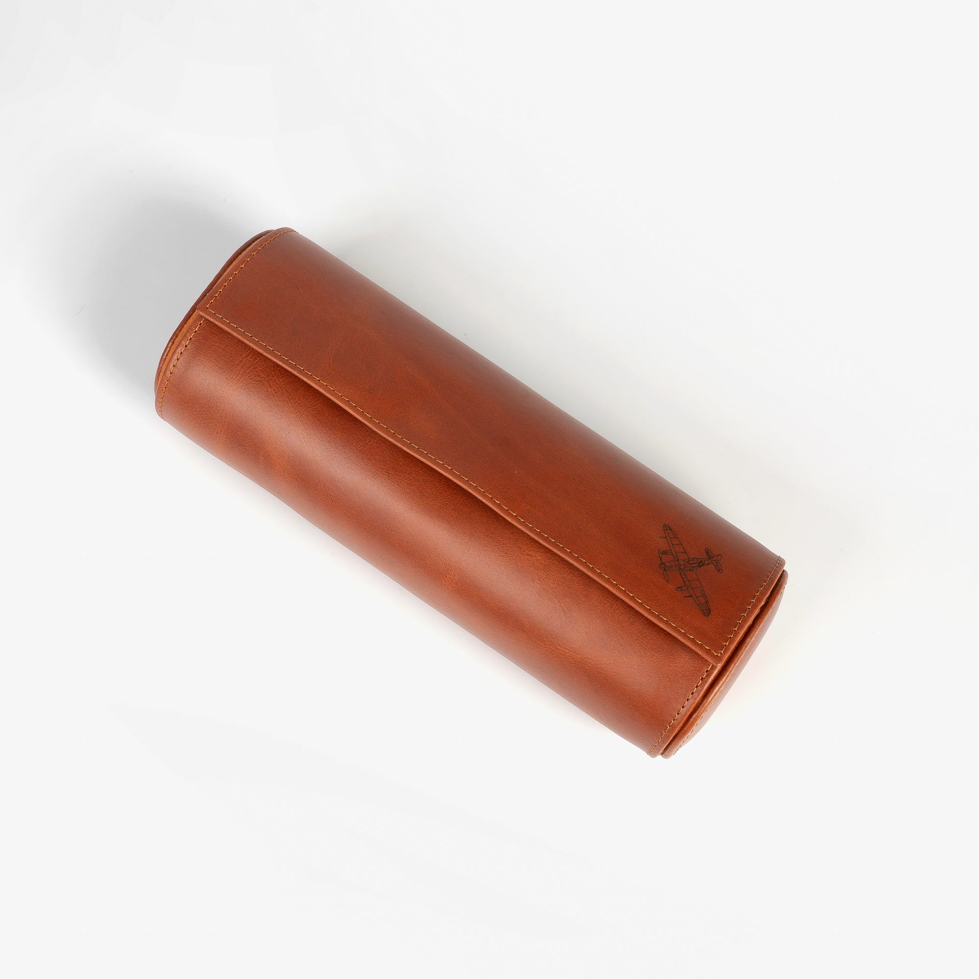 A leather travel watch roll displaying three elegant watches within a stylish case.