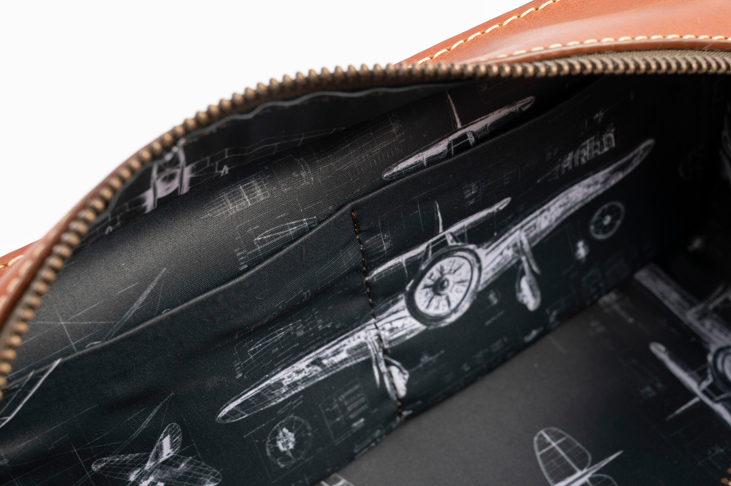 A brown leather travel pouch containing a toothbrush, toothpaste, and various toiletry items for personal care.