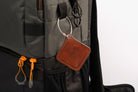 Leather luggage tags with metal rings, elegantly designed for travel organization and personalization.