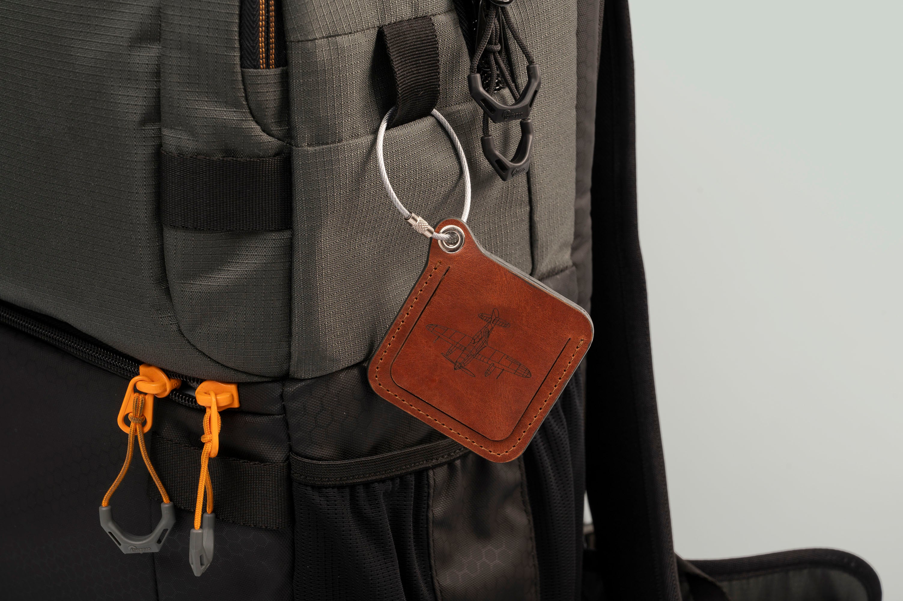 Leather luggage tags with metal rings, elegantly designed for travel organization and personalization.
