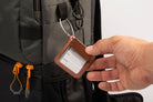 Leather luggage tags with metal rings, elegantly designed for travel organization and personalization.
